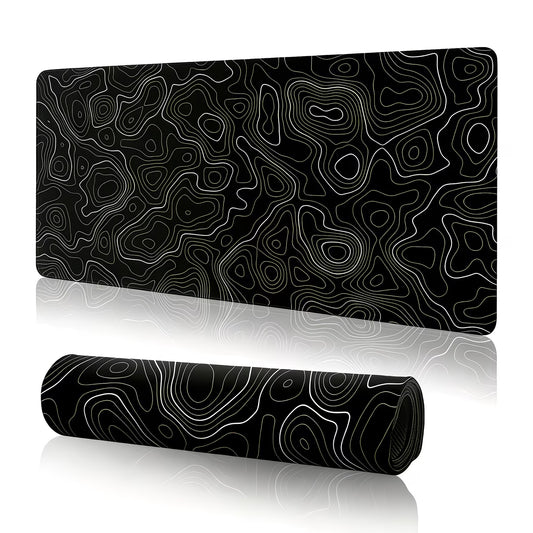 Black and white patterned desk mat with a rolled-up version on a white background