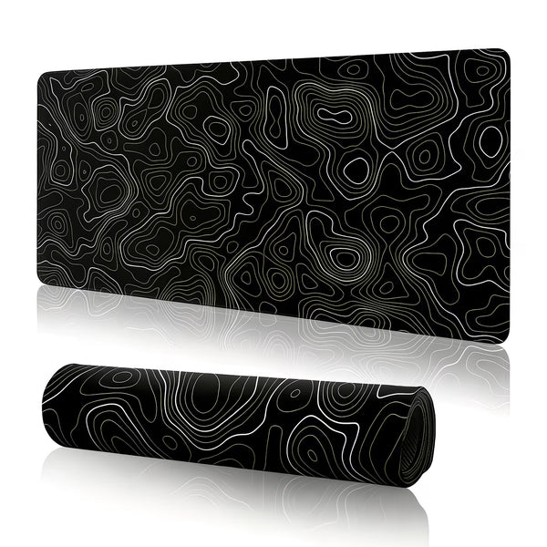Black and white patterned desk mat with a rolled-up version on a white background