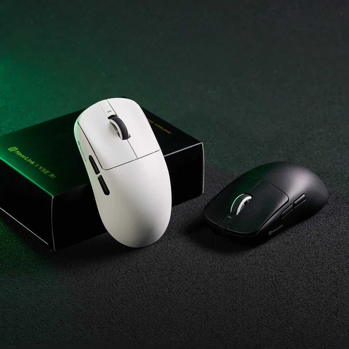 Two computer mice, one white and one black, on a dark surface with a green gradient background.